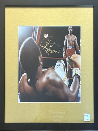 Item #328447 Signed Color Photograph of American boxer George Foreman after knocking down Joe...